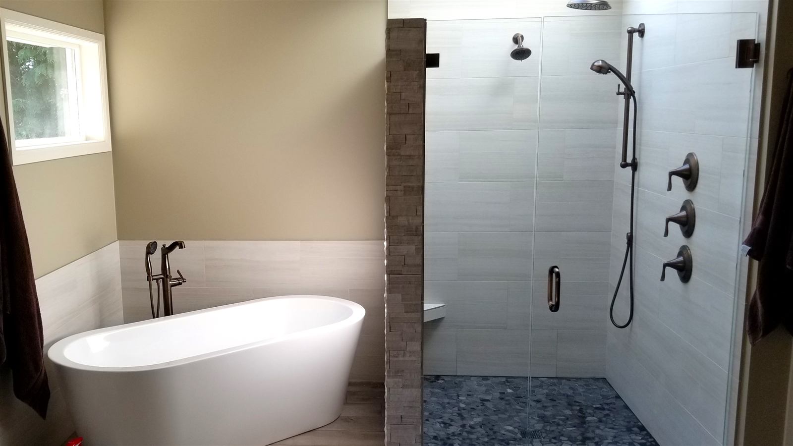 Freestanding soaking tub and walk-in tile shower in a Southwest Florida bathroom remodel